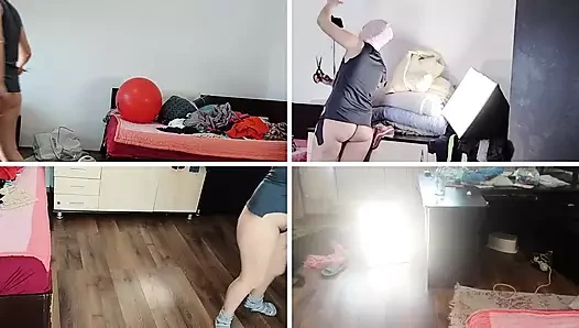 Жена танцует обнаженной дома в любительском видео. Женщина развлекается примеряя одежду и разрезая ее в любительском видео