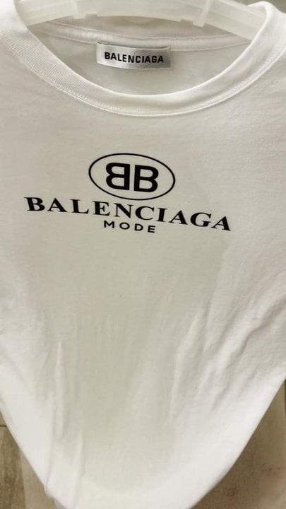 Finishing pissing on her Balenciaga t-shirt