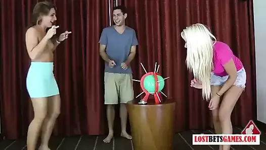 2 girls and one guy play a don't pop the balloon game