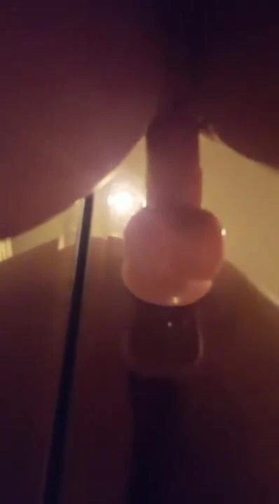Dildo fucking against the mirror