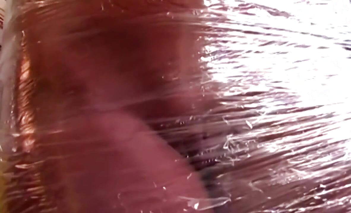 Plastic Wrapped Slut Gaping Wide Through Shiny Film