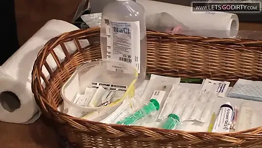MILF lies on the bed as pussy gets injected wit syringes