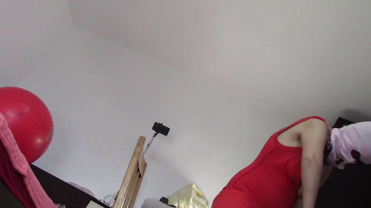 Amateur wife dancing naked at home. Amateur woman has fun trying on clothes and cutting them.
