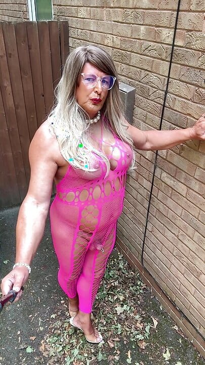 Sexy Crossdresser Kellycd2022's in pink fishnet catsuit and heels