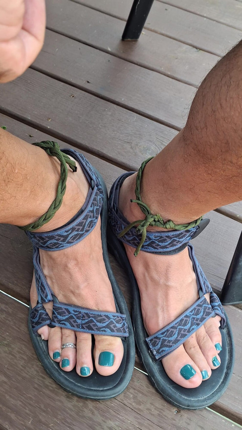Kneel down in front of me and jerk your cock to my feet in sandals and toe rings