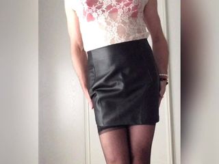 Sexy in leather skirt, stockings and satin lingerie