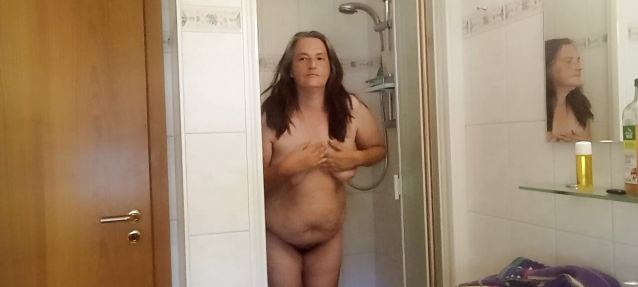 Mature German MILF 52 showers a chubby body under the shower