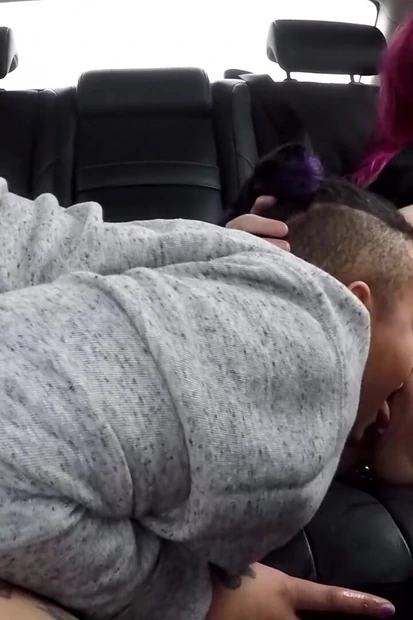 Buttplugged backseat babe's lezzing out