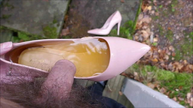 Piss in pink stiletto high heel