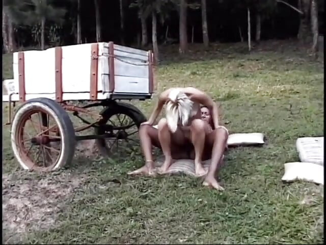 Horny blonde slut giving a blow to this young shemale outdoors
