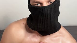 Masked horny hunk oiled up and teasing