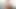 小柄なブロンドがストリップしてベッドで体を探索