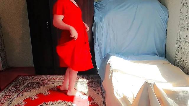 Cute sissy holding stuffed bunny in bed playfully