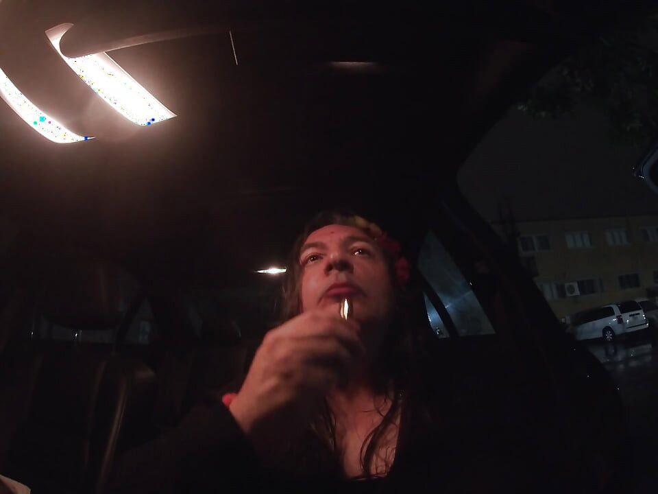 Mature sissy CD out in the rain in A parking lot in public masturbation.
