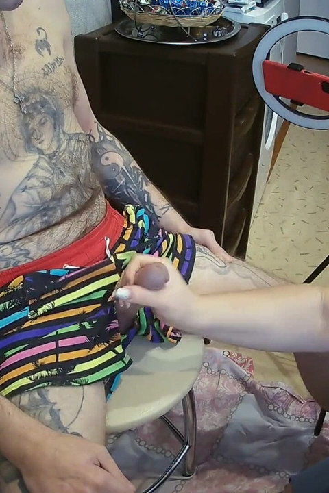 I'm sitting on a stool, a fat woman jerks off my cock