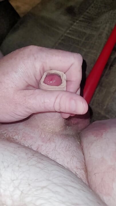 Watch my hard little cock cum with my ass filled up