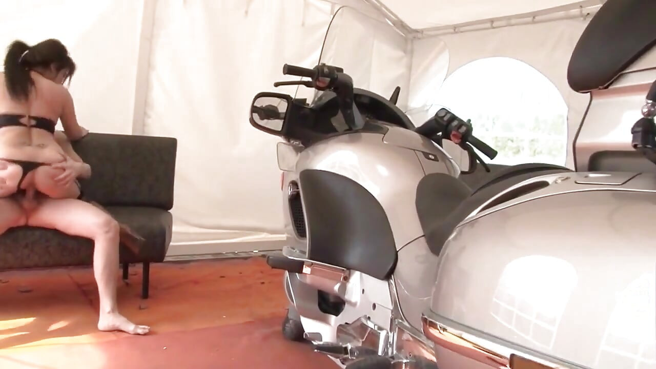Horny brunette gets fucked on motorcycle