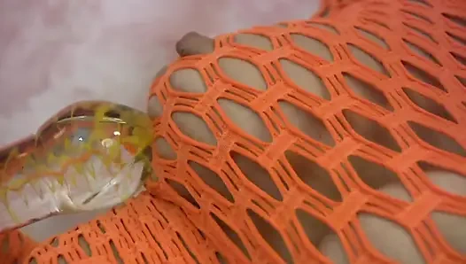 Hot teen in fishnet plays with her vibrator