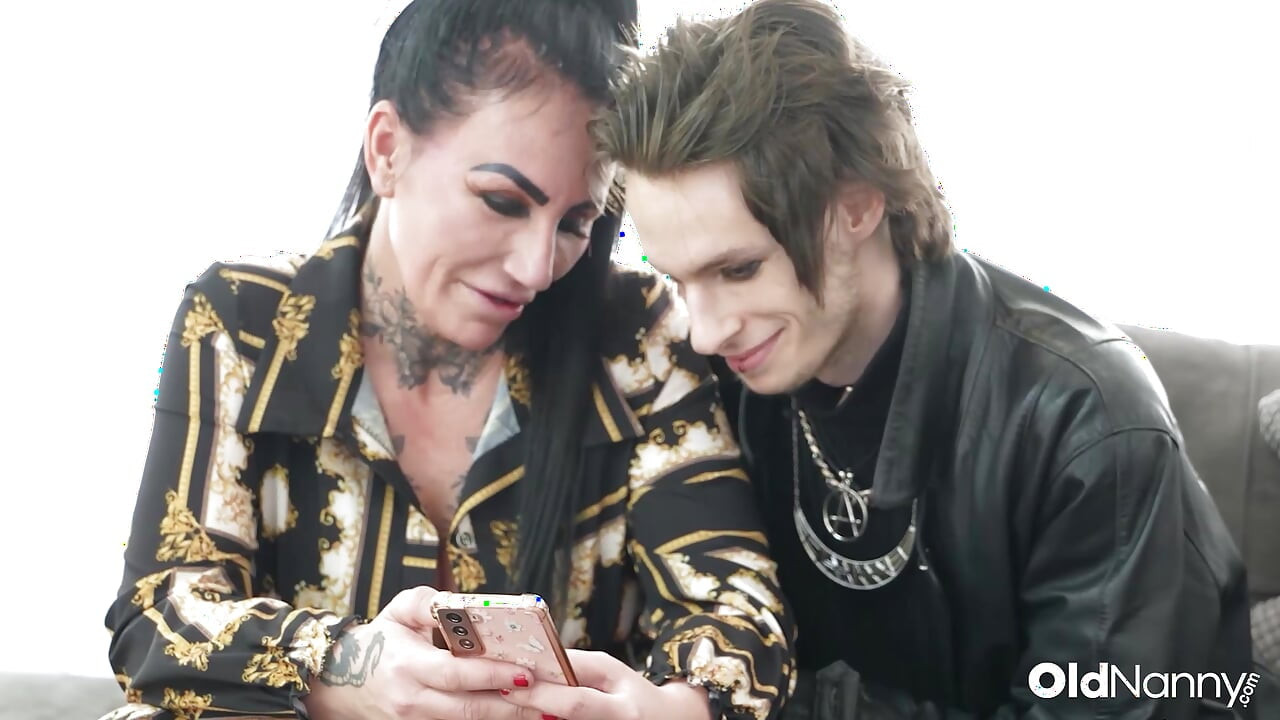 Inked Mature With Big Tits Gives Blowjob To Emo Stud
