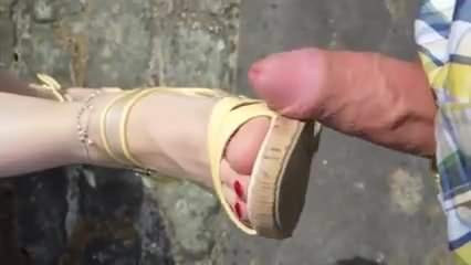 Footjob in public