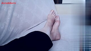 For comfort, Anna sits barefoot on the sofa - 1