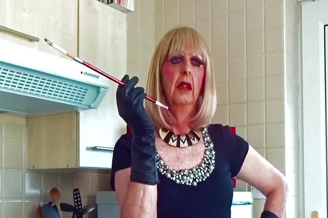 Glamorous Granny tranny Mandy smoking with sexy holder