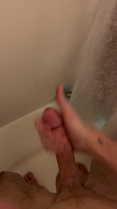 Young slim twink strokes big cock, squirts in the shower.