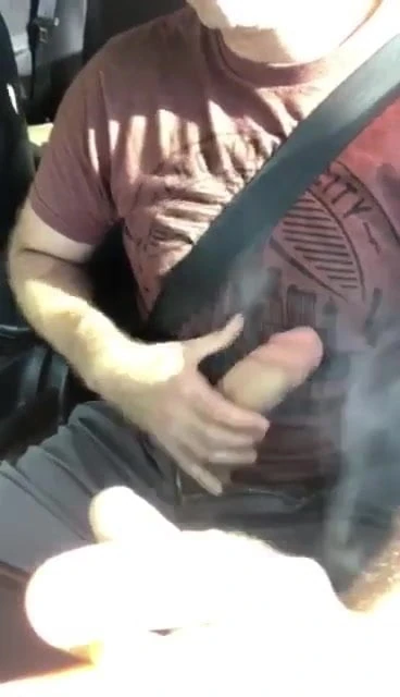 Driving and showing his big cock the world