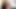 Busty transgender in stockings moans while masturbating