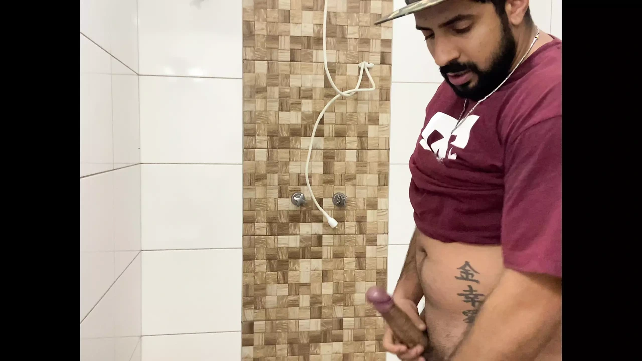 Squirting cum, bearded in a cap alone in the bathroom having fun in the handjob until cumming a lot – Rodrik Dick