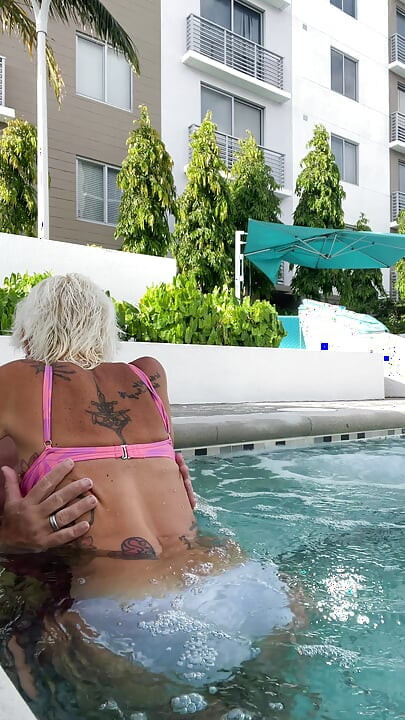 Getting frisky in the hot tub. Boob play.