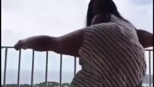 Hot girl dancing on balcony
