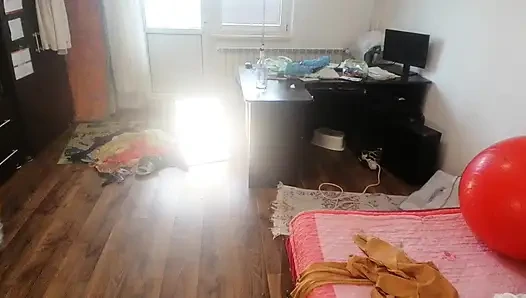 Amateur woman has fun trying on clothes and cutting them.