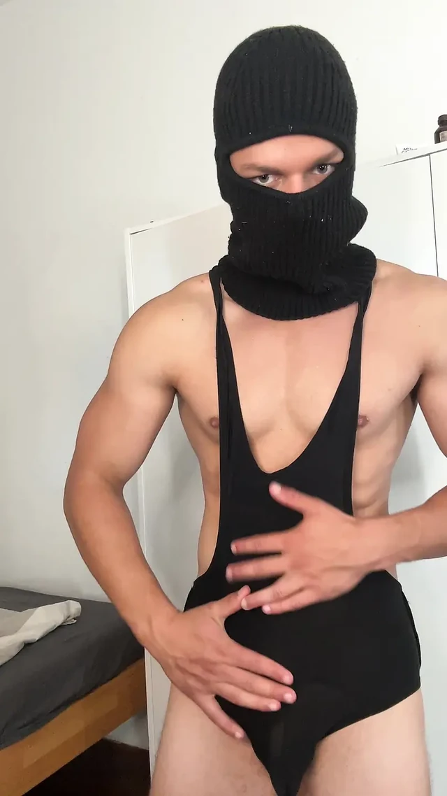 Muscle hunk teasing in a tight singlet
