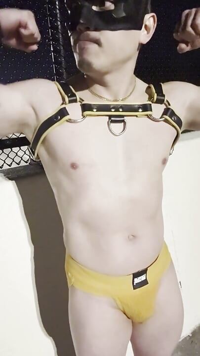Midnight Muscle Tease: Asian Hunk Flexes Ass & Biceps in Yellow Harness on Highway Bridge