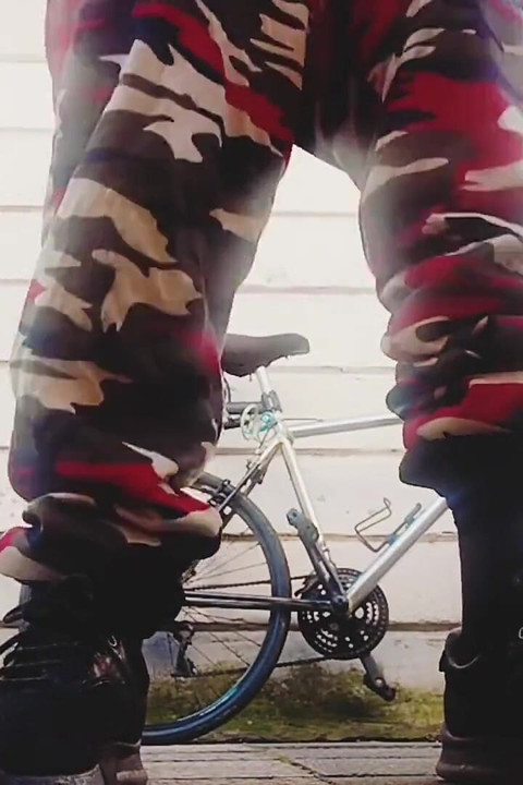 Young Man with His Bicycle Pees