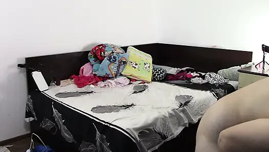 Sexy brunette doing naked chores around the house.