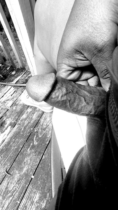 Jerking of on the deck in black and white.