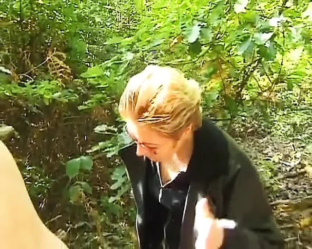 A mature German domina spanks her man in the woods