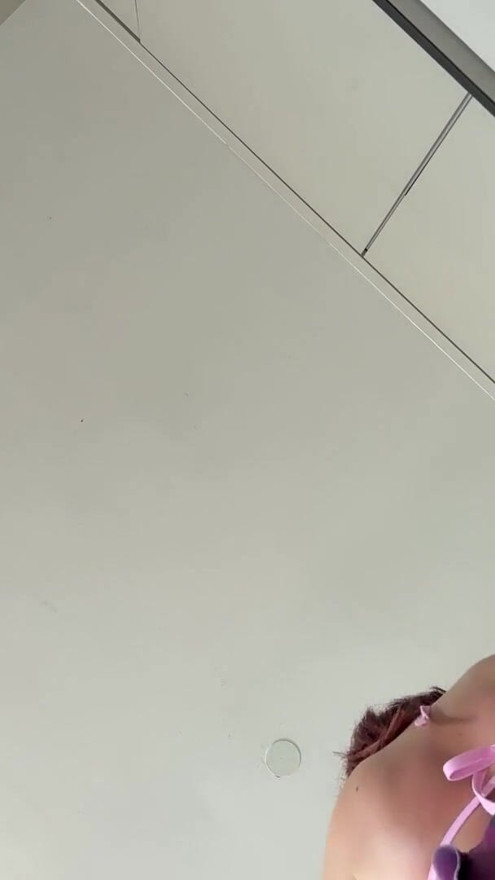 Real college girl in summer house prepares some fruits in the kitchen in the smallest bikini ever with a short skirt | Clip 1