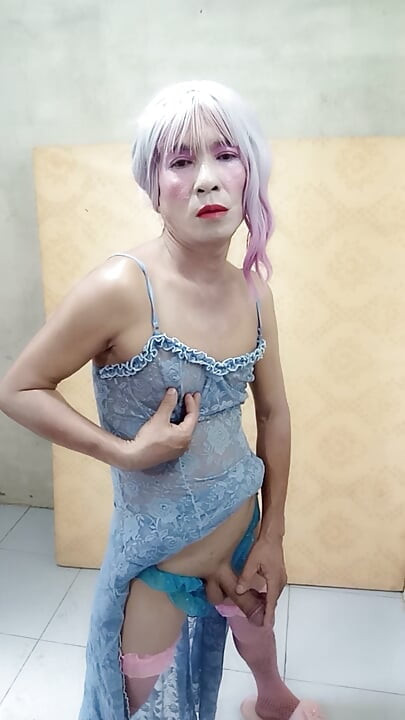 Oanh Le shemale eyes sexy dress porn standing with a happy cock leaning on her back