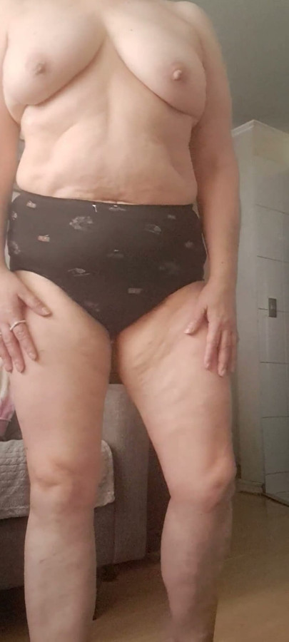 MILF Taking off Her Clothes and Stripping Down to Her Panties