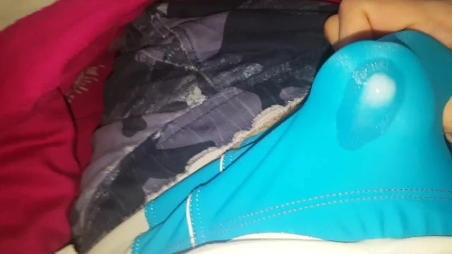 Shiny blue speedos cumming