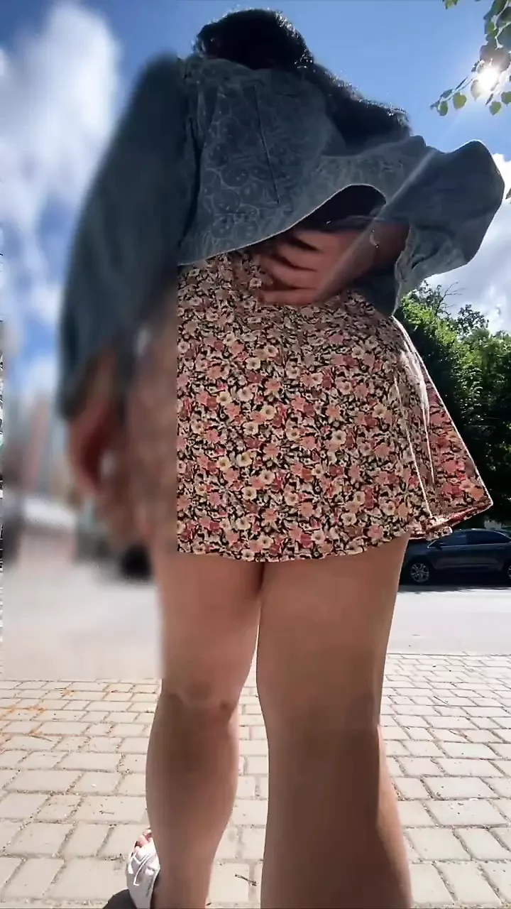 Milf walks around the store without panties