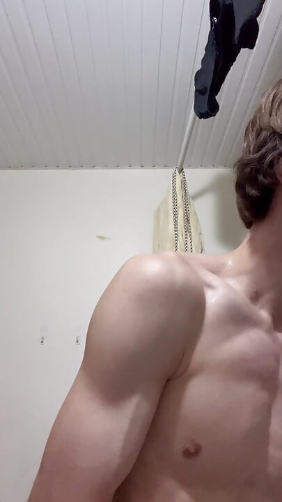 Sexy boy taking a shower