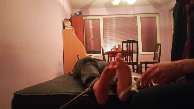 Bare feet tickle tortured