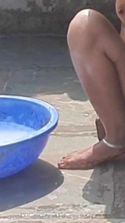 Spectacular moment from "Stepsister desi in beautiful red tights is bathing completely naked in the open bathroom in the"