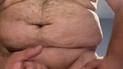 Masturbation into a glass followed by cum eating while wearing nipple clamps and butt plug