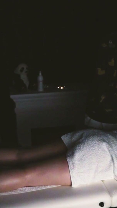 body and foot massage with a massage gun and hands | Clip 1