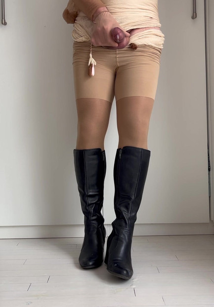 Shooting a fat load on my boots while wearing tan tights.